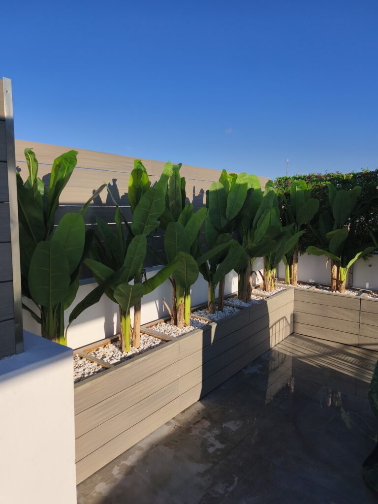 Outdoor planters with artificial plants