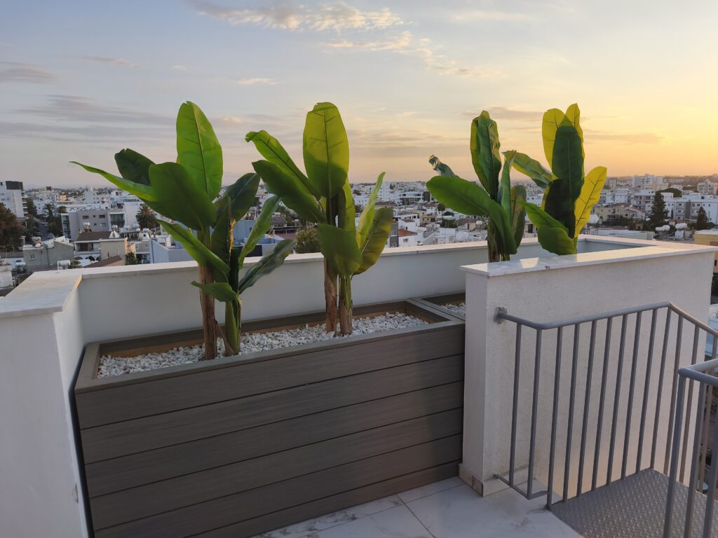 Outdoor planters with artificial plants